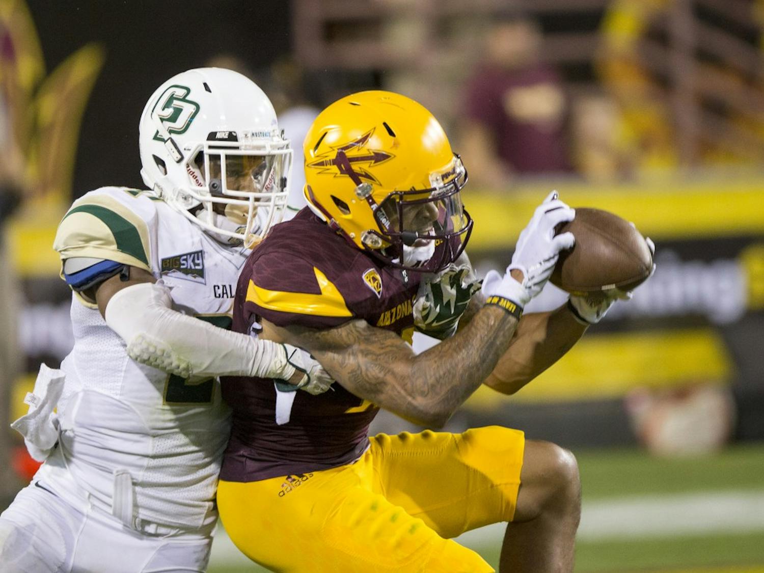 Wide receiver Devin Lucien snags a pass during a game against visiting Cal Poly at Sun Devil Stadium in Tempe on Saturday, Sept. 12, 2015. ASU beat Cal Poly 35-21 in their season opener. 