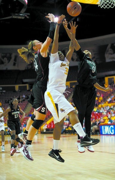 Physical play: ASU senior guard Tenaya Watson has her layup contested by a pair of Stanford guards, senior Jeanette Pohlen and redshirt senior Melanie Murphy. A dominant second half by the Cardinal resulted in a 72-54 victory over the Sun Devils. (Photo by Michael Arellano)