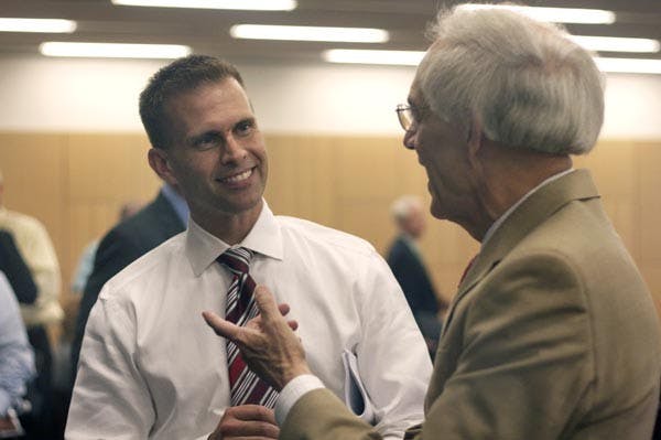 EXECUTIVE EVENING EVENT: Southwest Region President of Verizon Wireless Brian Danfield (left) spoke with students and faculty members Thursday afternoon about sales and sustainability within the company. (Photo by Scott Stuk)