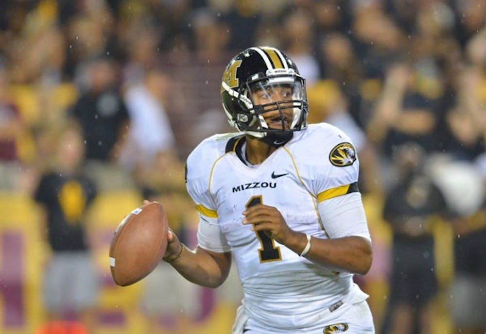 Missouri junior quarterback James Franklin searches for an open receiver during the Tigers’ away game against ASU last year. (Photo by Aaron Lavinsky)
