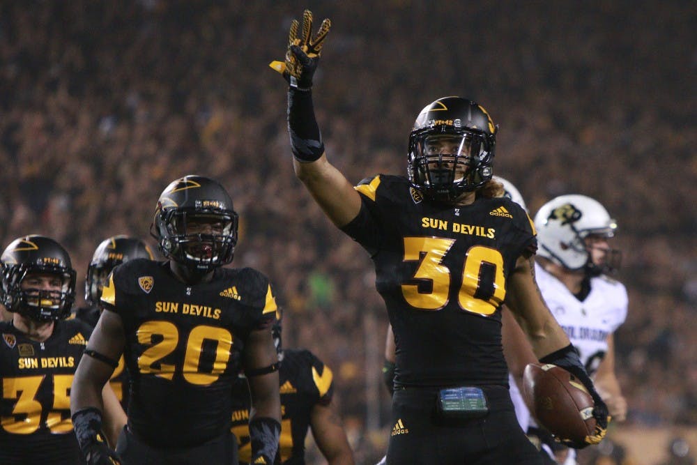 Redshirt freshman defensive back Dasmond Tautalatasi (30) reacts after scoring a touchdown on a blocked punt in the first quarter against Colorado on Saturday, Oct. 10, 2015, at Sun Devil Stadium in Tempe.