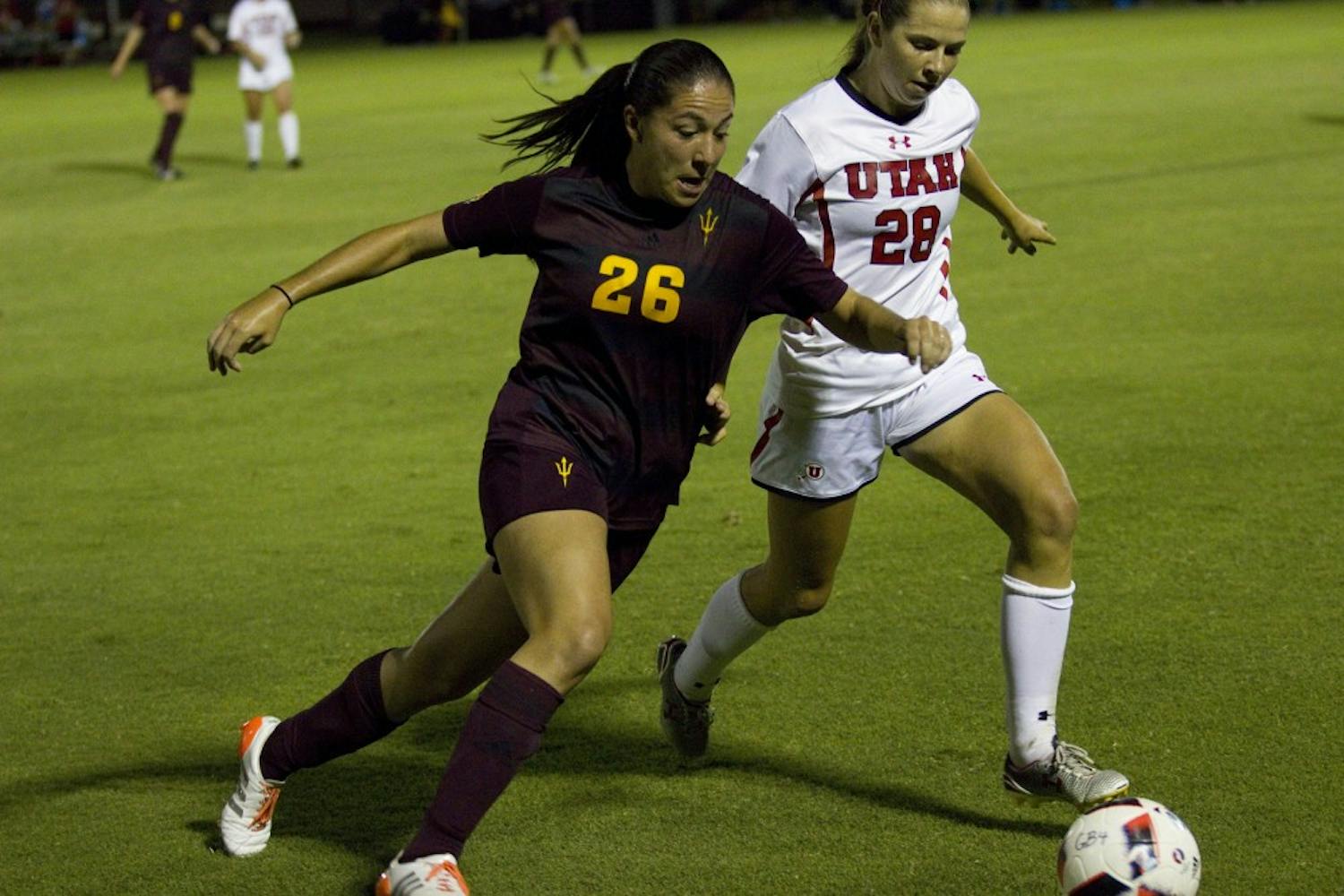 ASU sophomore forward Natalie Stephens tries to get the ball from a Utah defender in the 1-1 draw against the Utah Utes in Sun Devil Soccer Stadium in Tempe, Arizona, on Thursday, Sept. 29, 2016.