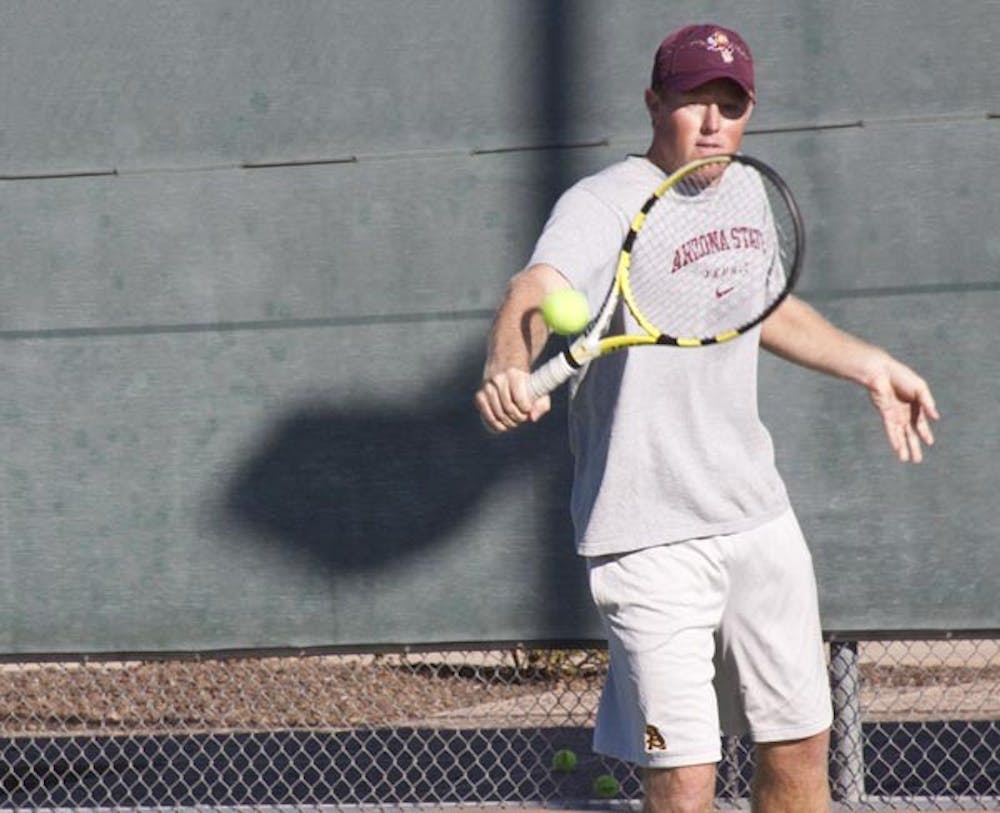SWEET SWING: Assistant tennis coach Clint Letcher backhands at practice last week. Letcher, who played at ASU from 2001-2005, has been an assistant with ASU for two years after joining the staff in Sept. 2008. (Photo by Annie Wechter)