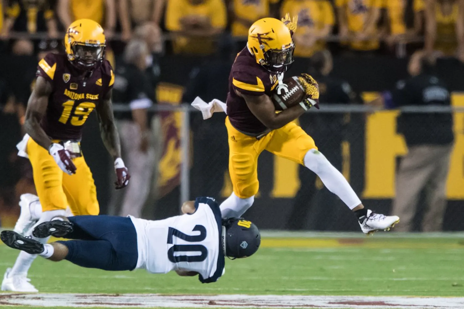 ASU's freshman Brady White almost breaks free from a tackle by NAU's sophomore Maurice Davidson in the first quarter on Saturday, Sept. 3, 20016, in Sun Devil Stadium.