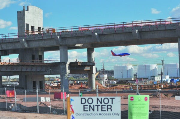 RAIL TO AIR: Construction has begun at Phoenix Sky Harbor International Airport for the PHX Sky Train. The first installment of the construction, projected to be finished in 2013, will connect passengers from the light rail to the east economy parking lot and Terminal 4 by way of a free, environmentally safe and driverless three-car train. (Photo by Sierra Smith)
