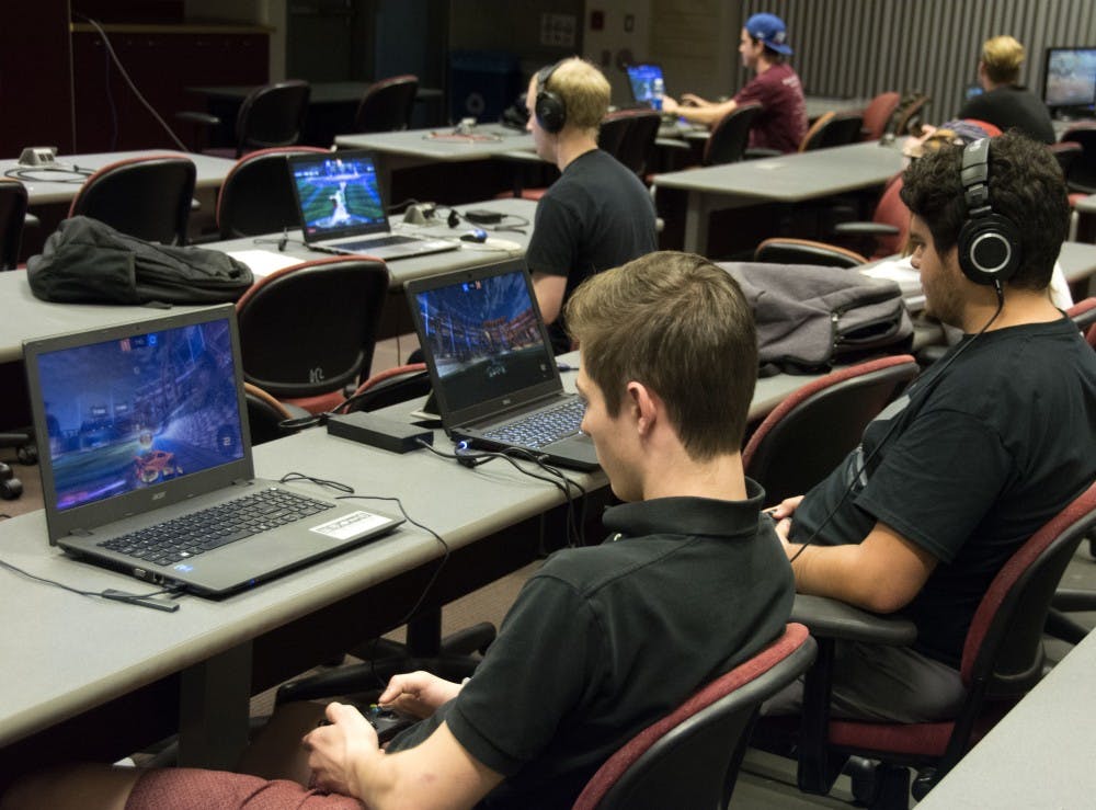 Chase C (center) and FloppinSonofaFish (right) compete in the Rocket Devil Arena tournament at Arizona State University in Tempe, AZ, on November 10, 2016.