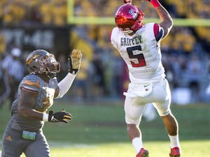 UA red shirt junior wide receiver Trey Griffey, right, pulls in a pass while guarded by senior defensive back Kweishi Brown during a game at Sun Devil Stadium in Tempe, Ariz., on Saturday, Nov. 21, 2015. The ASU Sun Devils took down the UA Wildcats, 52-36. 