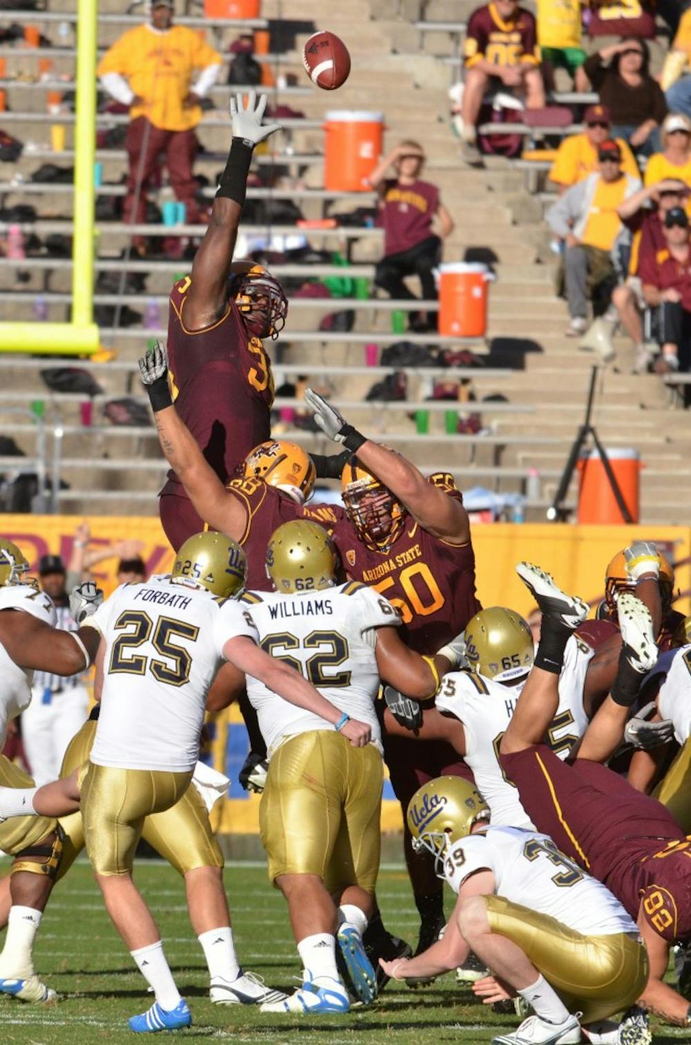 Saying farewell: ASU senior defensive end James Brooks reaches to block a field goal attempt during the Sun Devils’ 55-34 win over UCLA in November. Brooks has decided to leave the team due to personal reasons. (Photo by Aaron Lavinsky)