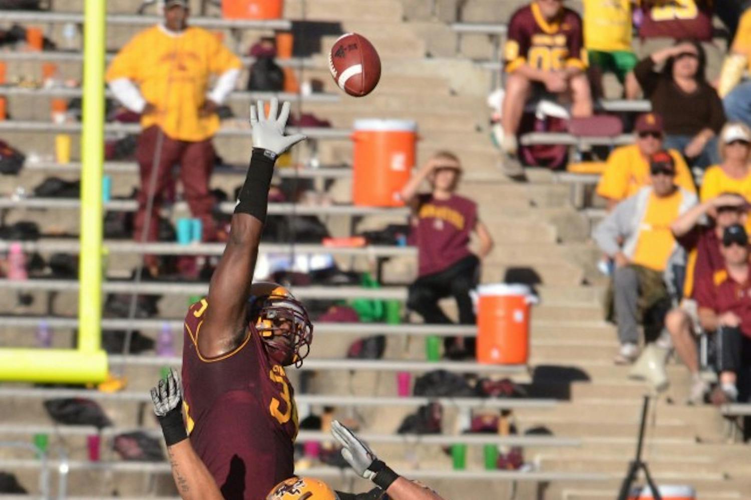 Saying farewell: ASU senior defensive end James Brooks reaches to block a field goal attempt during the Sun Devils’ 55-34 win over UCLA in November. Brooks has decided to leave the team due to personal reasons. (Photo by Aaron Lavinsky)