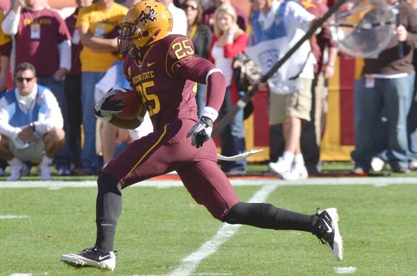 BACK SOON: ASU sophomore running back Deantre Lewis breaks away from the UCLA defense during last season’s meeting on Nov. 26. Lewis said he is close to returning after being struck by a stray bullet in February. (Photo by Aaron Lavinsky)