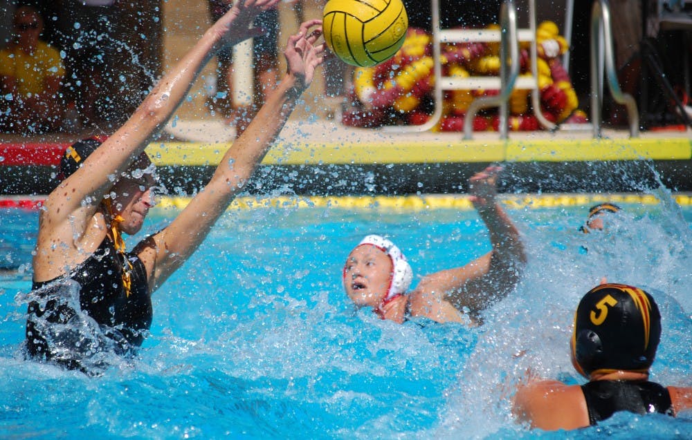 Redshirt freshman goalie E.B. Keeve lifts her hands up to block a shot by Stanford. The No. 3 ASU water polo team learned why Stanford is No. 2 after the Cardinal won 17-7. (Photo by Murphy Bannerman)