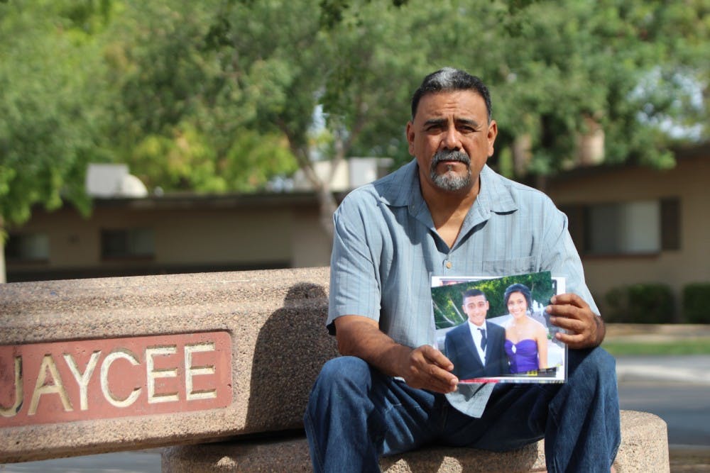 Rick Salinas, father of Adrienne Salinas, holds up a picture of his daughter who went missing over three weeks ago. So far the people of Tempe have raised over 8,000 for a reward if anybody finds her. (Photo by Dominic Valente)