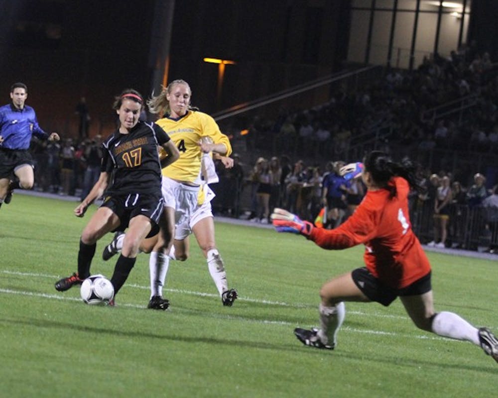 Freshman forward Carli Farquharson attempts a shot past NAU freshman goalkeeper Natalie Gilbertson during ASU’s 4-0 win over the Lumberjacks on Aug. 24.  (Photo courtesy of Steve Rodriguez)