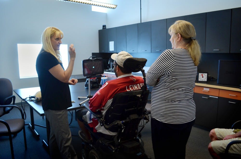 Prentke Romich Company representative Tami Taylor demonstrates the eye gaze technology that is enabling communication and internet access for those with speech and mobility disabilities. (Photo by Karen Loschiavo)