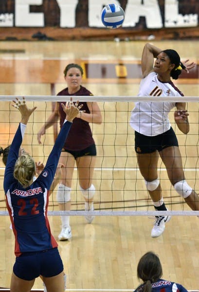 AERIAL ATTACK: Sophomore middle blocker Erica Wilson goes up for a spike against UA on Friday. ASU pushed the match to five sets, but the No. 23 Wildcats got the win. (Photo by Aaron Lavinsky)