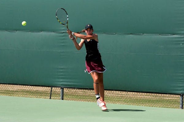 Then-Sophomore Ebony Panoho returns the ball with a backhand in a match against Colorado on April 4. (Photo by Mario Mendez)
