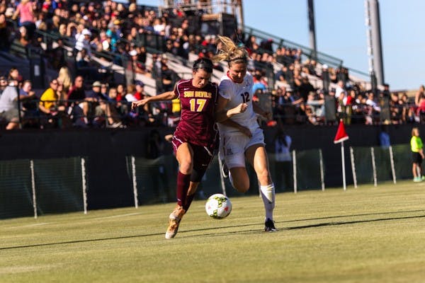 Junior forward Cali Farquharson battles with senior Arizona defender Mykaylin Rosenquist during the ASU vs Arizona soccer game on Friday, Nov. 7, 2014. Farquharson’s efforts during the play would result in a corner kick. (Photo by Daniel Kwon)