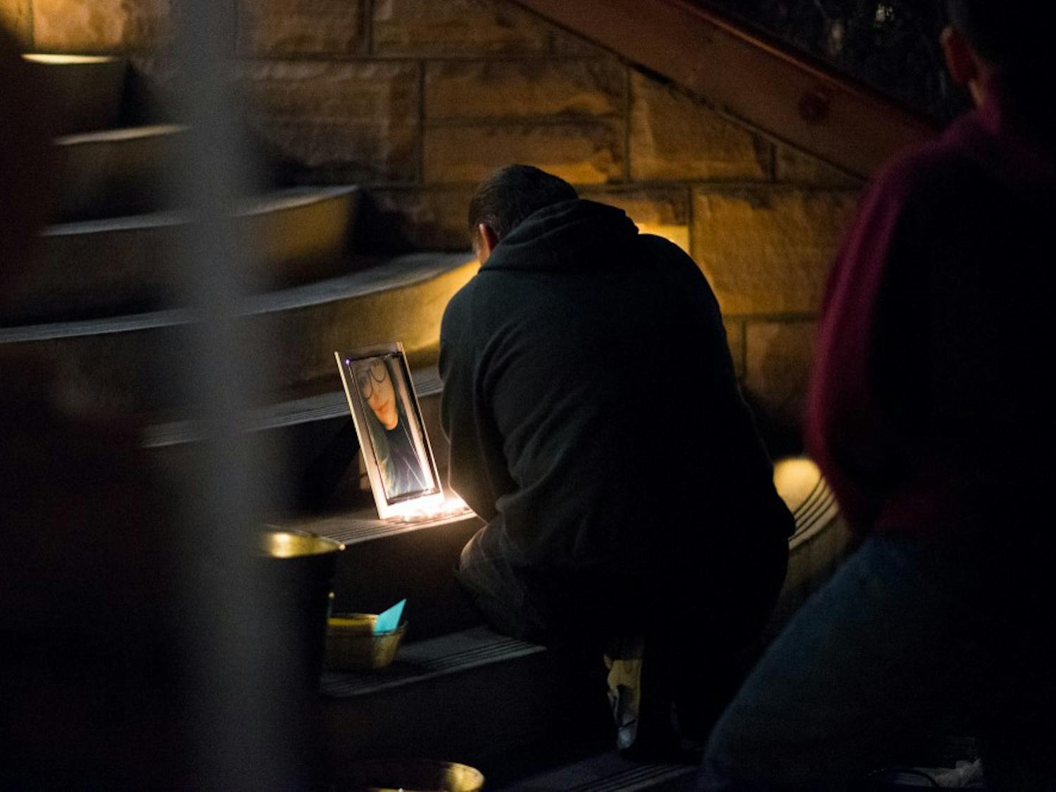 Bernardo Ruiz cries at a memorial for his niece Jelissa on Wednesday, Jan. 13, 2016, at Old Main on the Tempe campus.