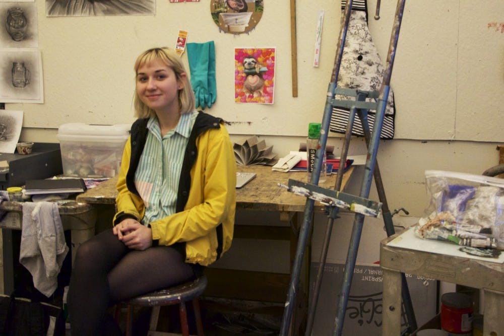 Senior drawing major Ellie Craze poses for a portrait in her studio in the Art building on Tuesday, Feb. 2, 2016, in Tempe.