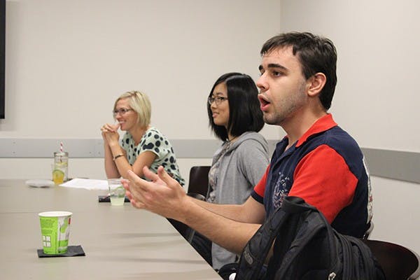 Faculty members and students discuss recruitment for the first ASU Ethics Bowl team at the open house meeting on Sept. 15, 2014.? (Photo Courtesy of the Lincoln Center for Applied Linguistics) 