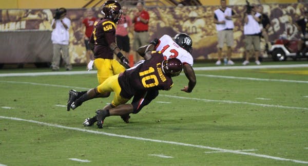 Redshirt senior safety Keelan Johnson tackles Utah junior running back Kelvin York during the Sun Devils’ 37-7 win over the Utes on Sept. 22. (Photo by Vince Dwyer)
