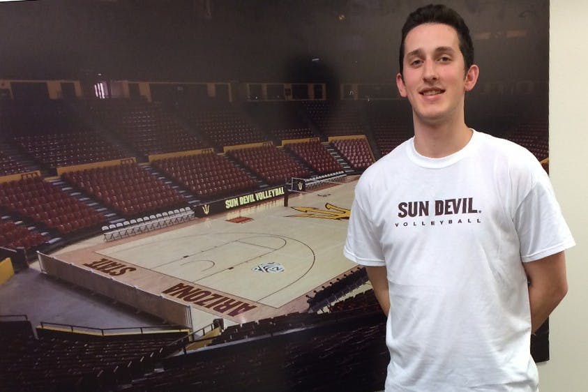 Chris Rose poses for a picture outside his office in Carson Center on Tuesday, March 1, 2016. He was officially announced as assistant volleyball coach earlier in the day.