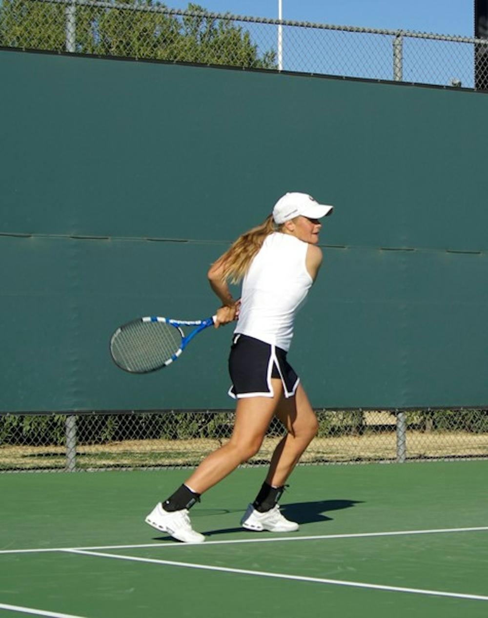 FALLING BACK: Senior Michelle Brycki tracks down the ball during a match against Iowa State last January. Despite starting the meet strong, the Sun Devils dropped all of their matches on Saturday at the ITA Southwestern Regional Championships. (Photo by Nathan Meacham)