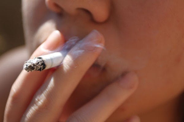 SPLIT DECISION: All four campuses are divided on their policies concerning smoking and smoking areas.  (Photo by Nikolai de Vera)