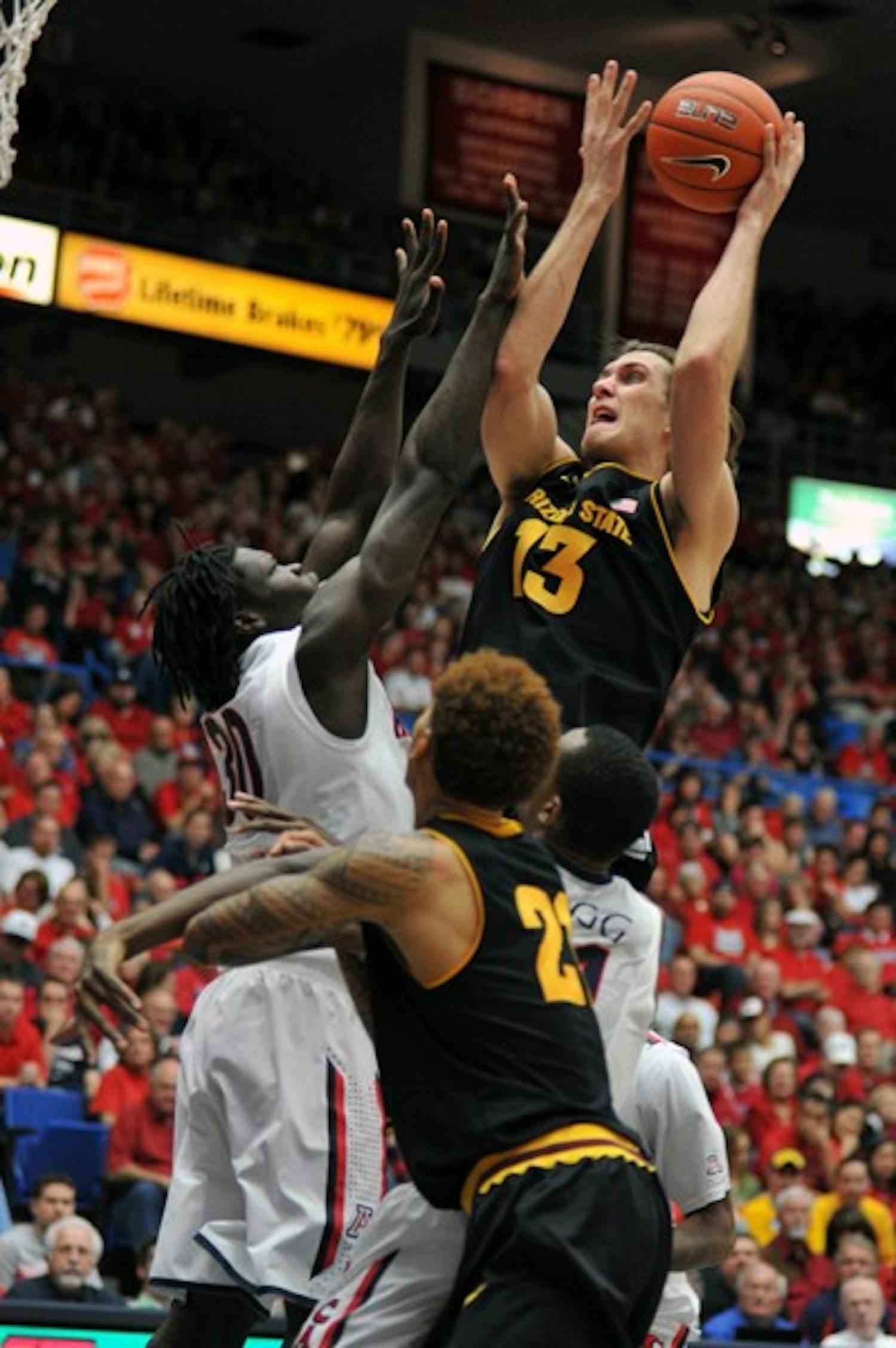 Jordan Bachynski shoots in traffic against UA on Dec. 31, 2011. Bachynski finished the game with 10 points, seven rebounds and four blocks as the Sun Devils lost to the Utes 64–43 on Saturday. (Photo by Aaron Lavinsky)