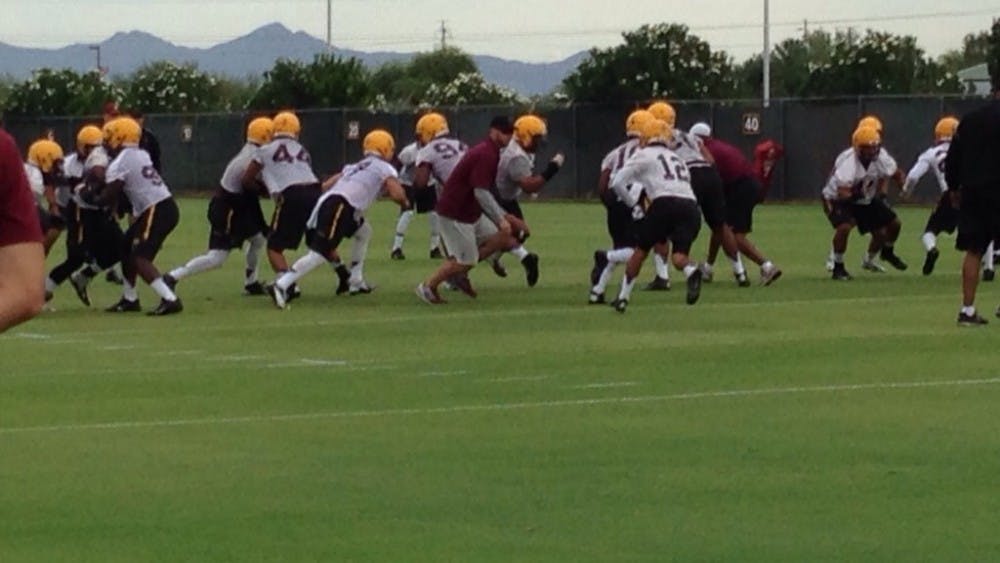 Sun Devils run through drills in their second day of practice for the 2014-2015 season (Photo by Logan Newman)
