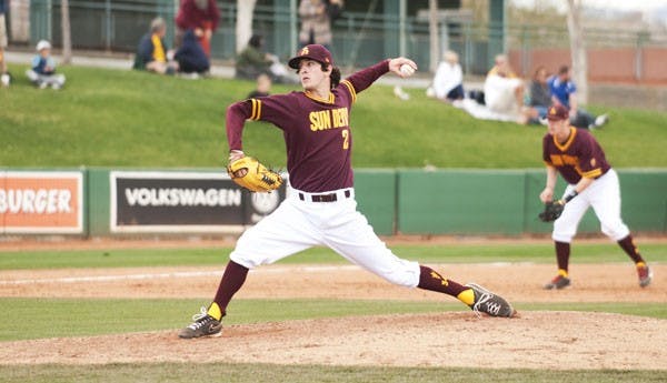 Freshman pitcher Brett Lilek flips his wrist back before hurling a pitch in the Alumni Game on Feb. 9. Lilek has missed most of the season due to arm soreness. (Photo by Molly J. Smith)