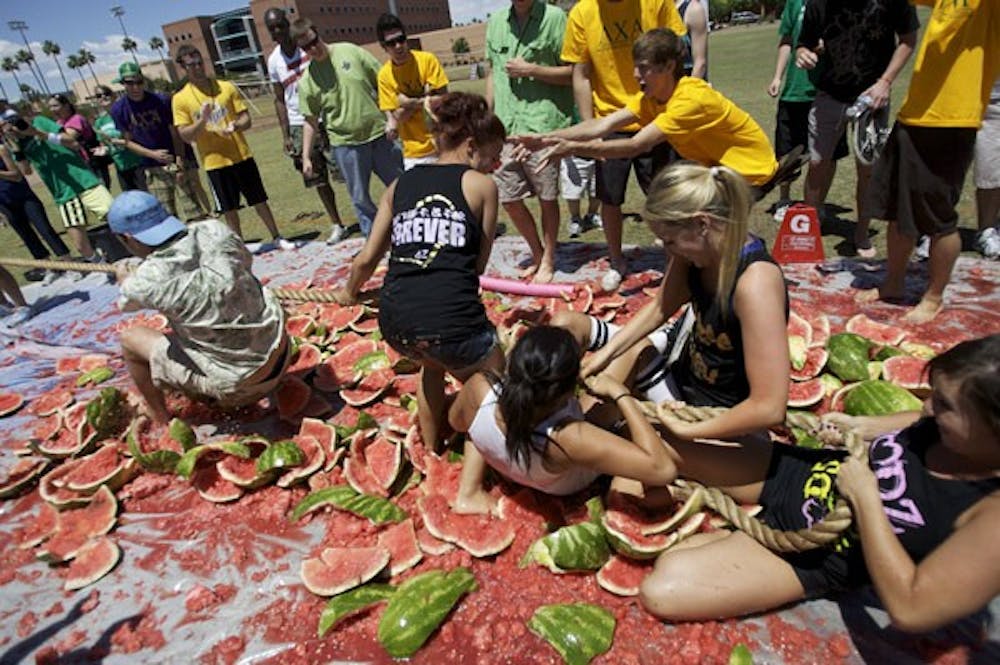 WHAT-A-MELON: Girls from Delta Zeta participated in an event put on by the Lambda Chi Alpha fraternity. Several other sorority's were in attendance and took part in the games. (Photo by: Scott Stuk)