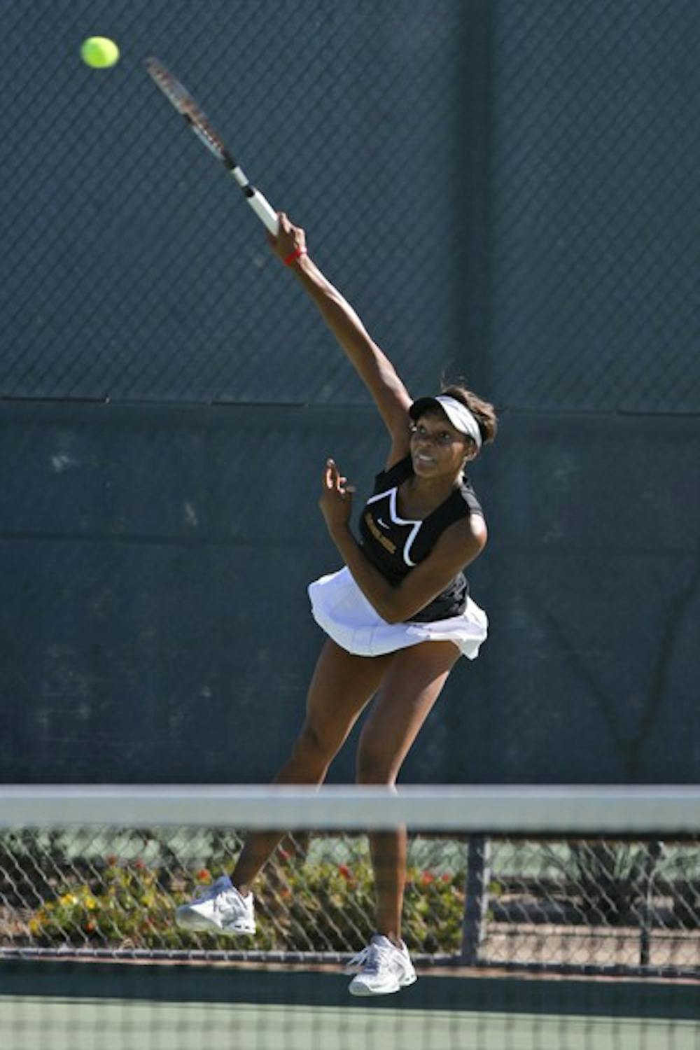 Senior Sianna Simmons follows through on a serve against Sacramento State on March 2. The Women’s tennis team faces Washington State this weekend before finishing the regular season against some of the best teams in the Pac-12. (Photo by Sam Rosenbaum)