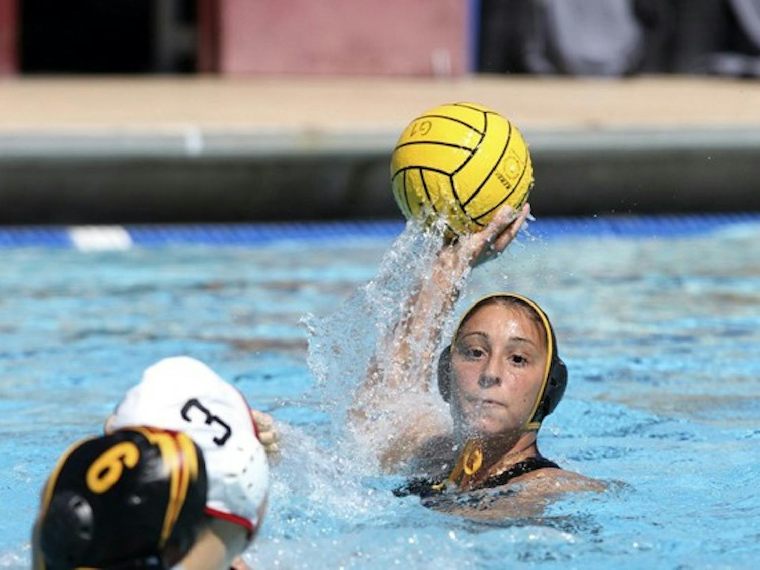 Mariam Salloum prepares to pass the ball in a game against San Diego State on March 3. Salloum, a senior, plans to return home to Germany after this year to attend graduate school and continue playing water polo. (Photo by Sam Rosenbaum)