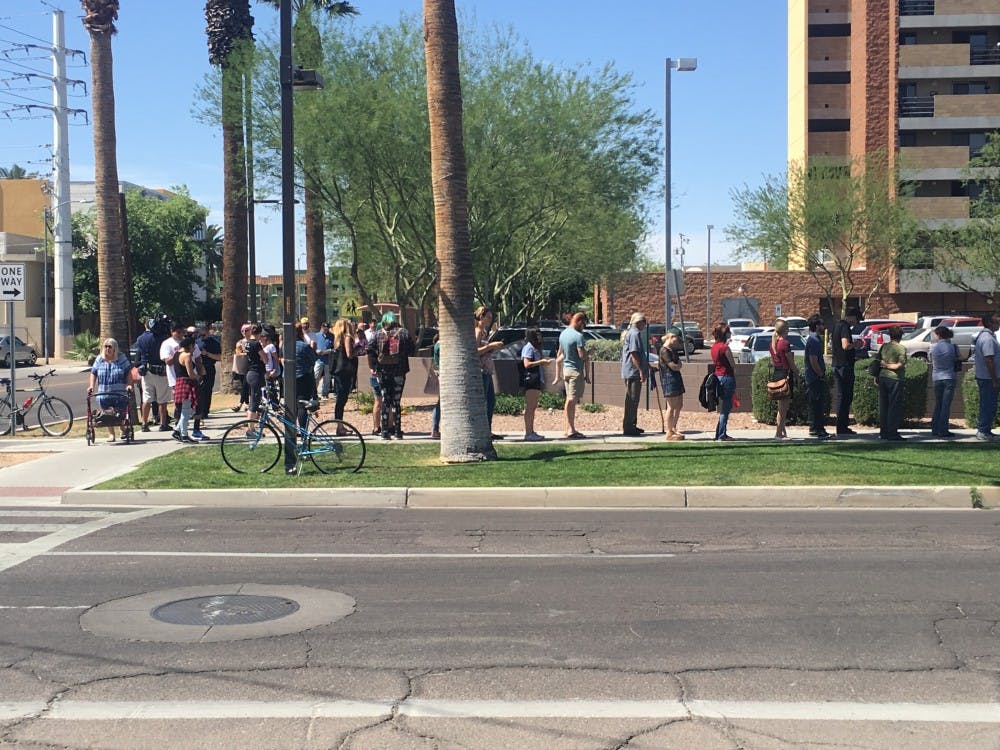 Voters line up outside the Salvation Army Citadel on Third Avenue and Fillmore Street on Tuesday, March 23, 2016, in Phoenix. &nbsp; 