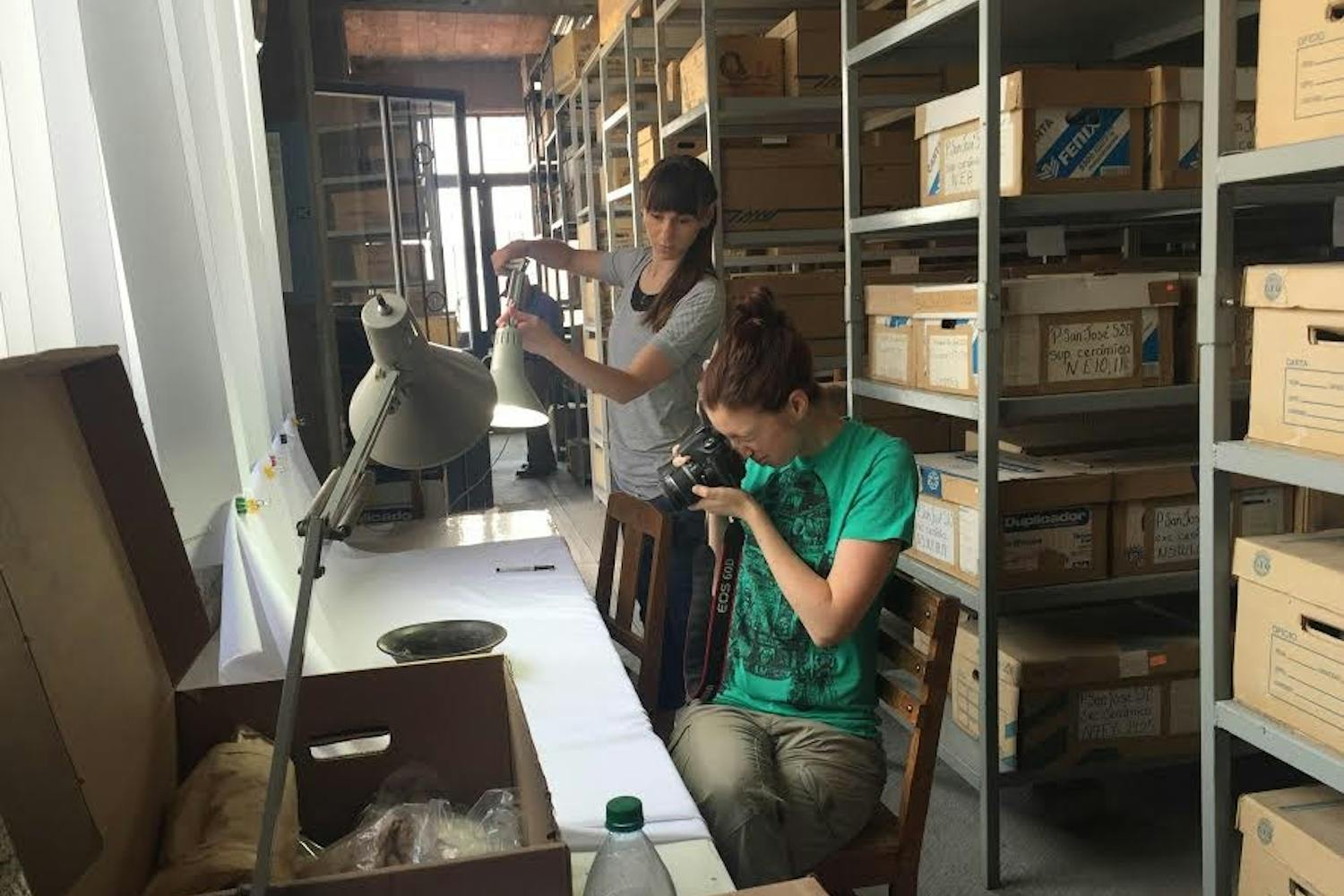 Katie Rush and Lisa Gallagher, two museum studies students at ASU, work in a lab together.
