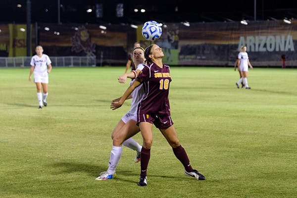 Redshirt senior forward Jessica Domenichelli heads the ball in a game against NAU, Saturday, Nov. 15, 2014 at Sun Devil Soccer Stadium in Tempe. The Sun Devils defeated the Lumberjacks 4-2. (Photo by Ben Moffat)