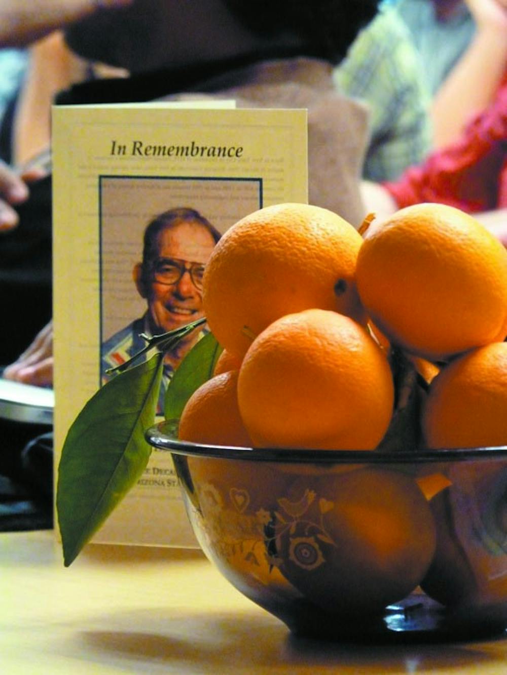 IN MEMORIUM: Co-workers and students held a memorial service for professor Don Miller, who often brought bowls of oranges from his garden to share with his classes. (Photo by Harmony Huskinson)