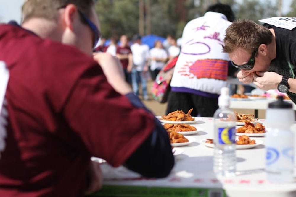 THE RACE BEGINS: On Saturday, ASU's Best Buddies Chapter held an event at the Student Recreation Center to raise awareness and funds for autism. The race started with eating 10 chicken wings and then completing a relay race.  (Photo by Nikolai de Vera)