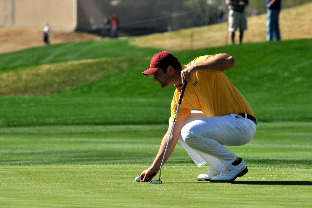 Junior Jon Rahm sets his ball on the green at the 9th hole of the 2015 Waste Management Phoenix Open on Feb. 1, 2015.