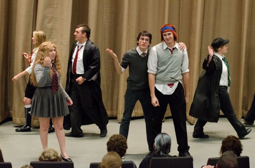 Cunning productions, a group made up of mostly ASU and MCC students, performs a Harry Potter musical show for hundreds of fans as part of the pre-film festivities.