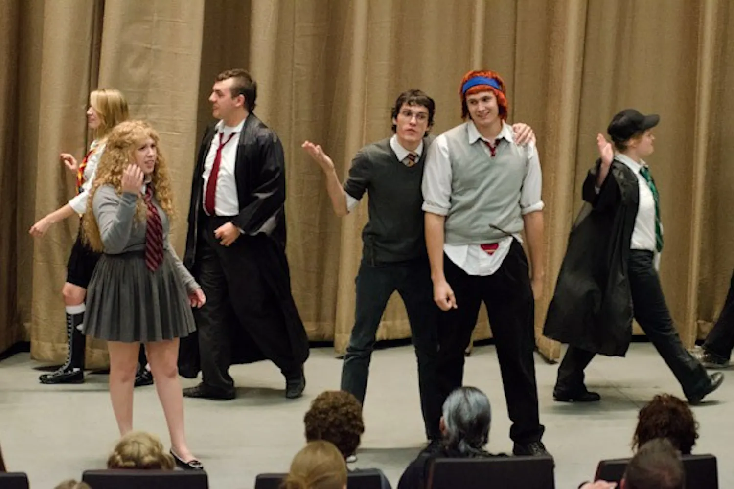 Cunning productions, a group made up of mostly ASU and MCC students, performs a Harry Potter musical show for hundreds of fans as part of the pre-film festivities.