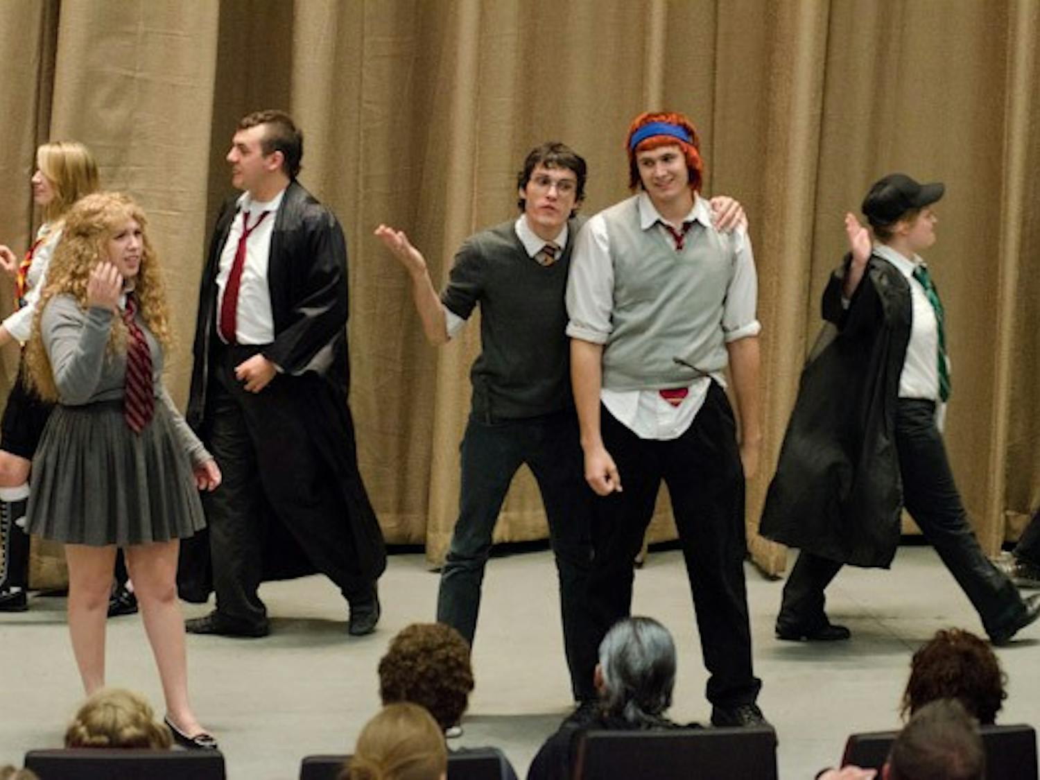 Cunning productions, a group made up of mostly ASU and MCC students, performs a Harry Potter musical show for hundreds of fans as part of the pre-film festivities.