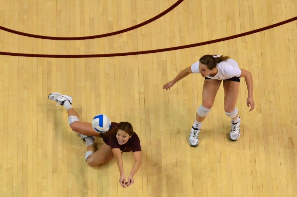 Junior libero Stephanie Preach goes low for a dig in the fourth set.