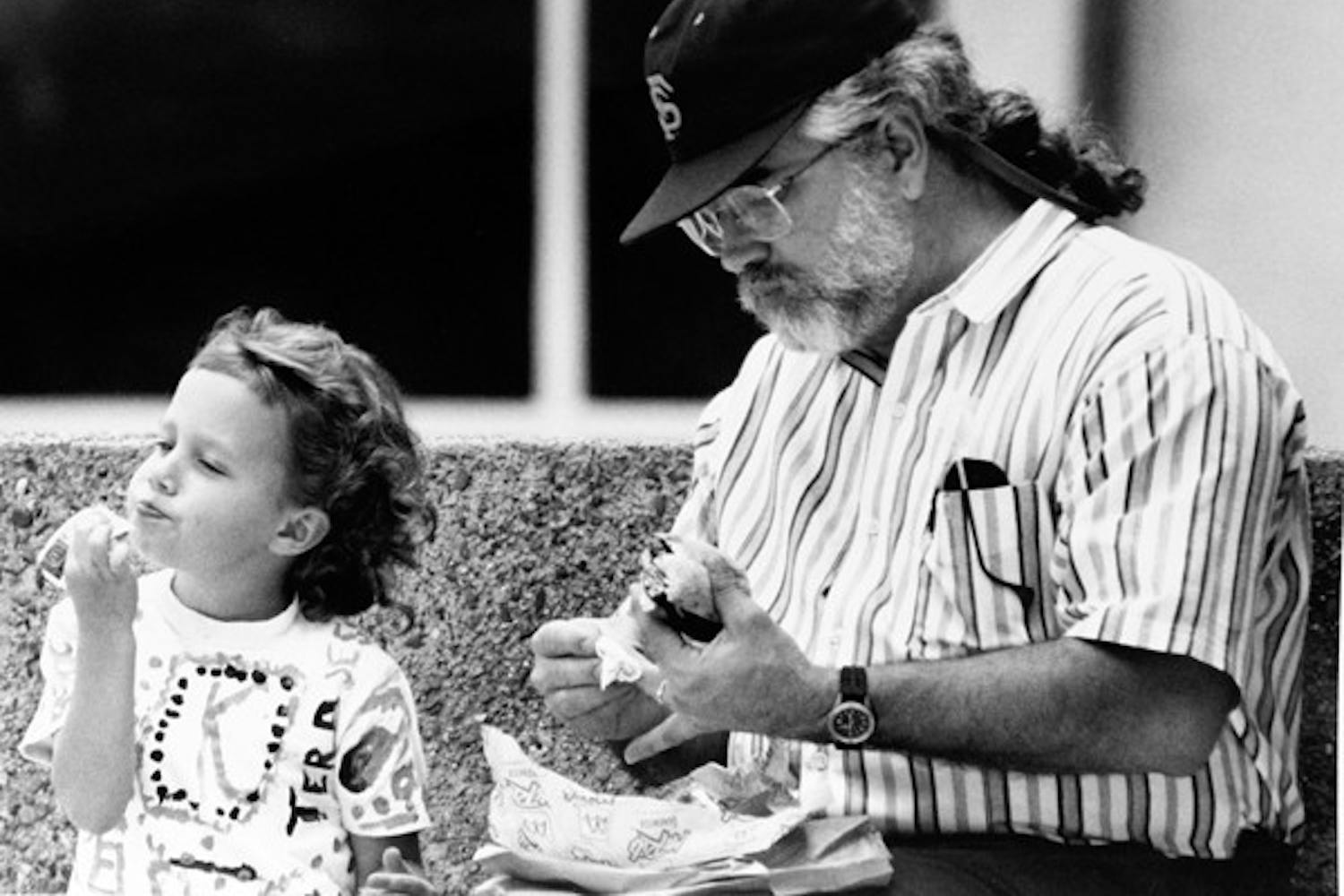 KETCH-IN UP ON LUNCH: Five-year-old ASU student Kelsey Wolf gets pure enjoyment out of eating the ketchup right out of the packet in 1992. (Photo by Darryl Webb)