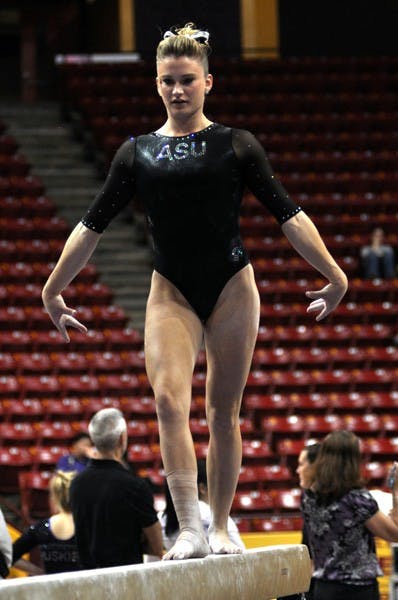 Heading out: ASU junior Madison Snowden performs on beam during the Sun Devils’ win over Washington on Feb. 18. Snowden and senior Beaté Jones head to Oklahoma on Saturday to represent ASU at the NCAA regional meet. (Photo by Sierra Smith)