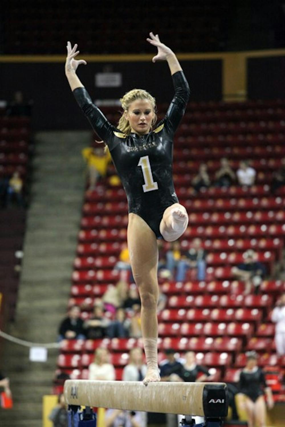 Senior Madison Snowden performs on the beam against UA on Jan. 27. Snowden and the rest of the Gym Devils compete in their first quad-meet Saturday night. (Photo by Beth Easterbrook)