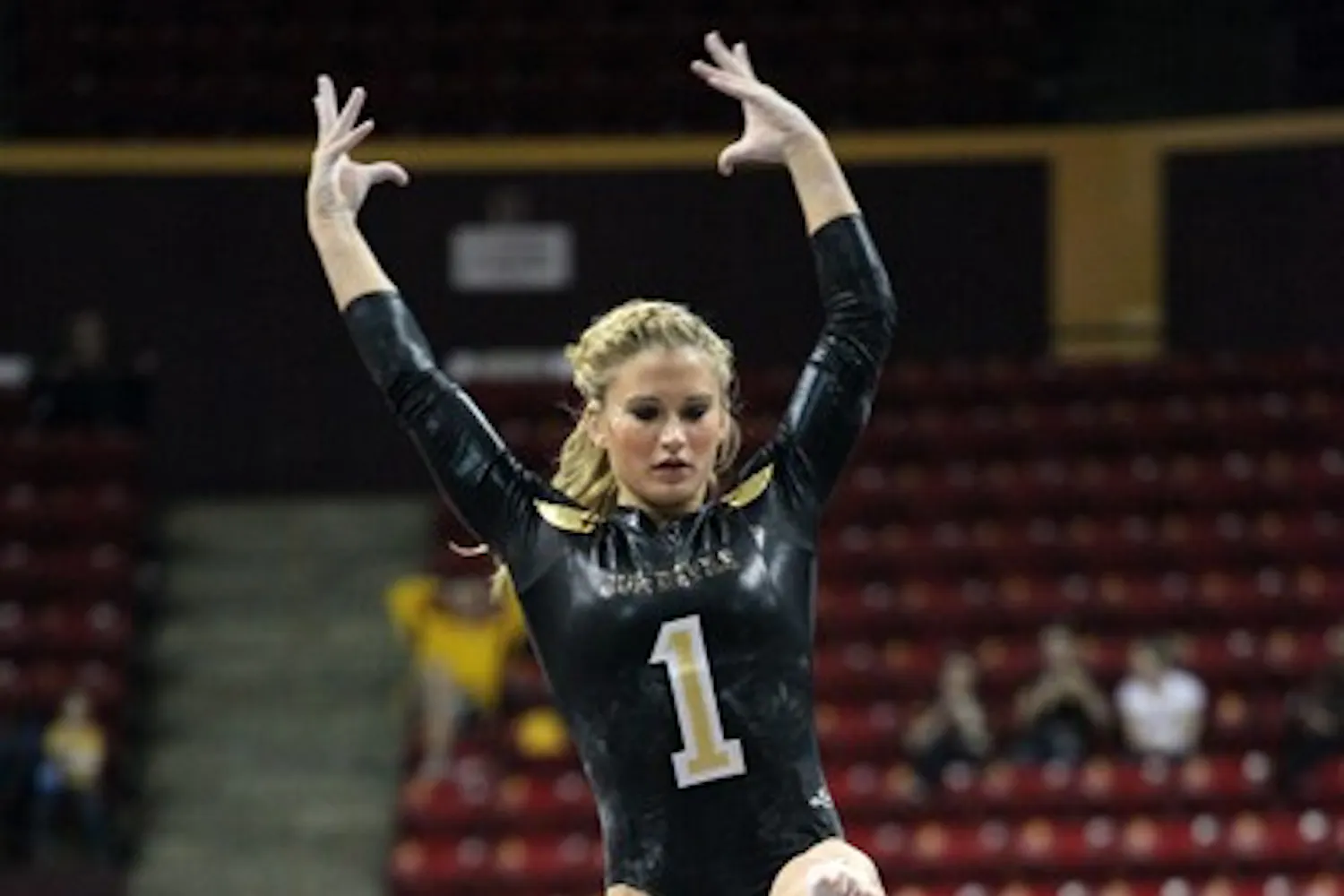 Senior Madison Snowden performs on the beam against UA on Jan. 27. Snowden and the rest of the Gym Devils compete in their first quad-meet Saturday night. (Photo by Beth Easterbrook)