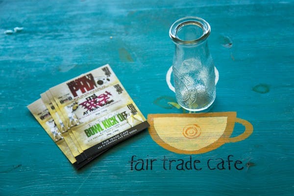 The bright blue tables add flair at Fair Trade Café. (Daniel Kwon/The State Press)