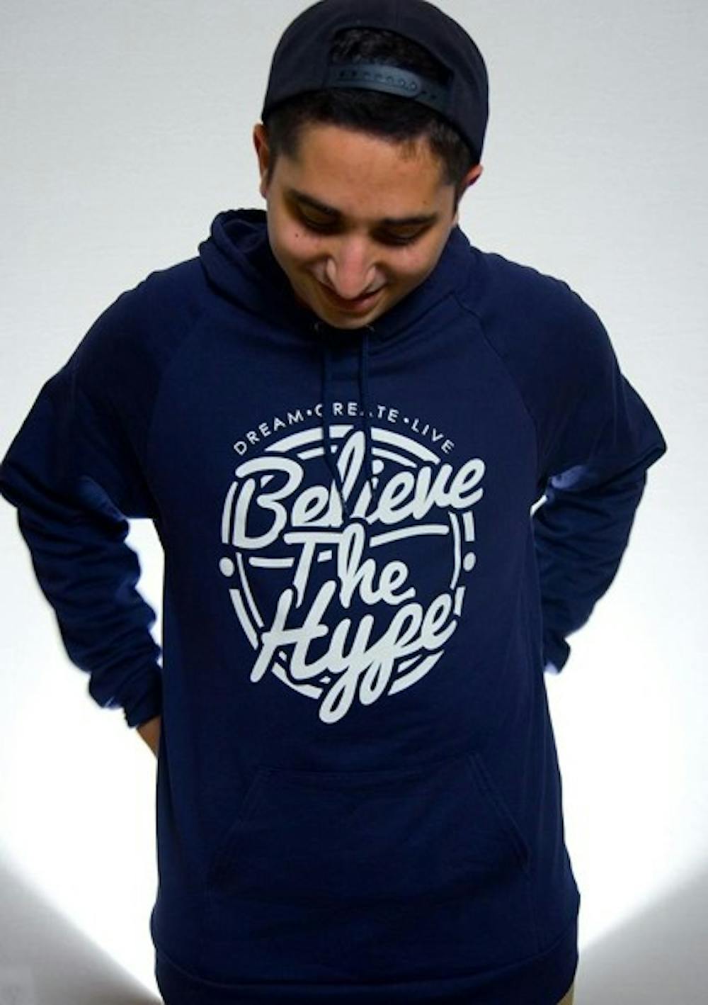 Neema Mahmoodi poses in a Believe The Hype hoodie. Mahmoodi established Believe The Hype clothing approximately a year ago. (Photo Courtesy of Andrew Franz)